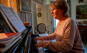 woman playing a piano