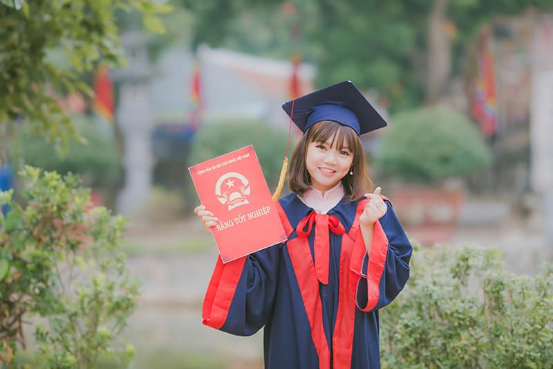 a person holding a diploma